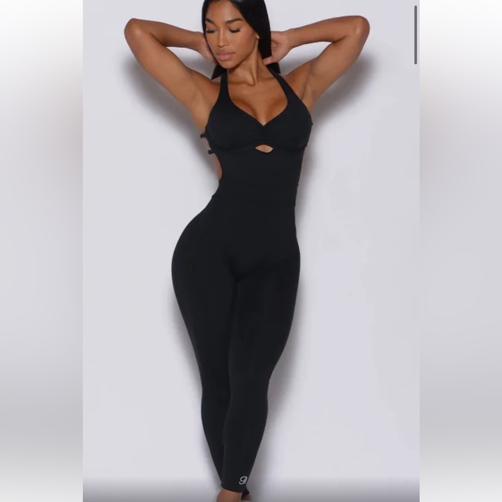 Bombshell sportswear cross back full bodysuit cat suit with push up pads.